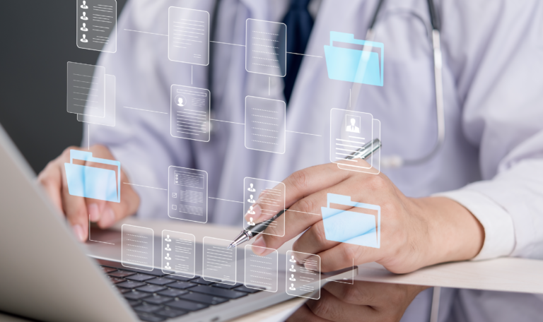 Healthcare provider using home healthcare scheduling software on a laptop to manage patient visits, nurse schedules, and real-time updates with House Call The App